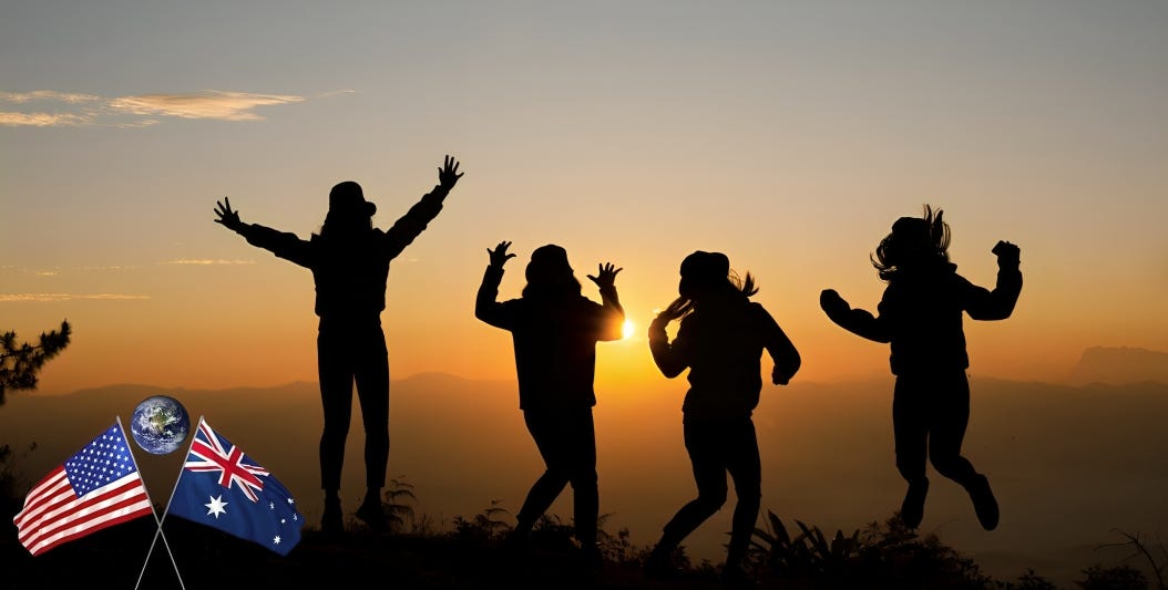 Family celebrating on hilltop at sunset, with American and Australian flags visible in the lower left corner. Diverse heritage represented with American, Australian, European, Asian, and South American ancestry.