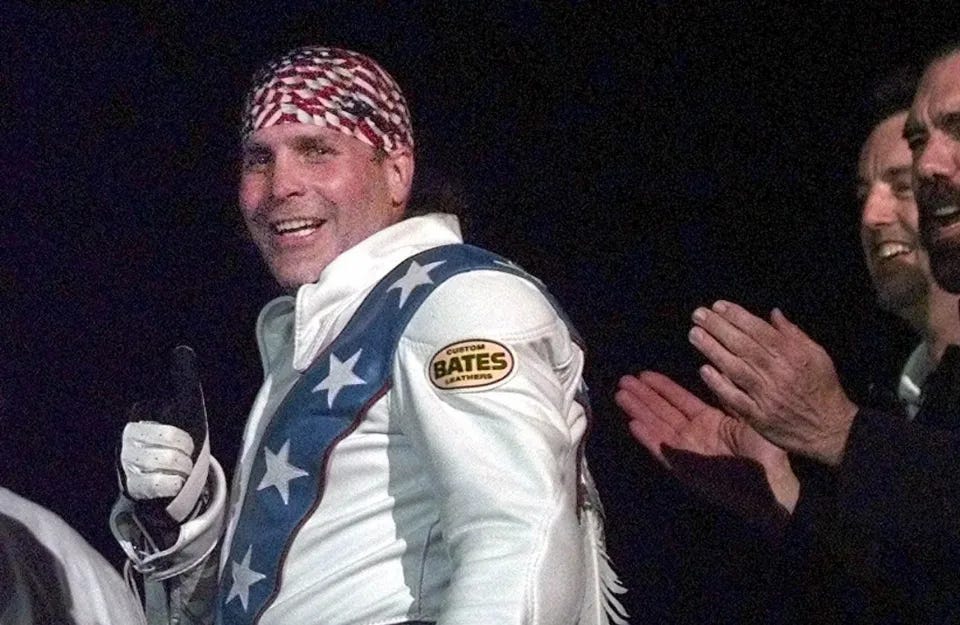 Robbie Knievel gives a thumbs-up after jumping a train at the Texas State Railroad Park in Palestine, Texas, on  Feb. 23, 2000.&nbsp; / Credit: AP Photo/LM Otero