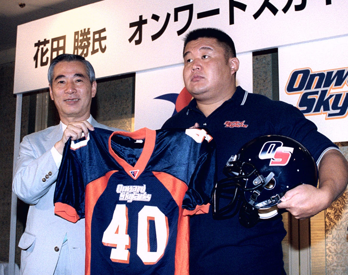 Masaru Hanada (right), better known as former yokozuna Wakanohana, joined the X League's Onward Skylarks in August 2001. | KYODO