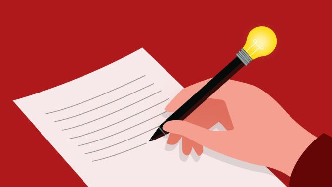 Hand with pen writing on paper