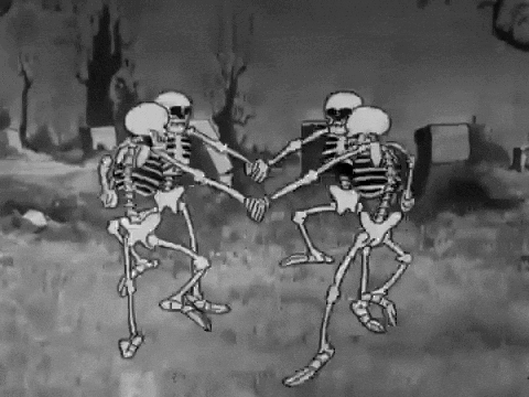 A gif from a black and white animation of four skeleton holding hands in a circle and dancing