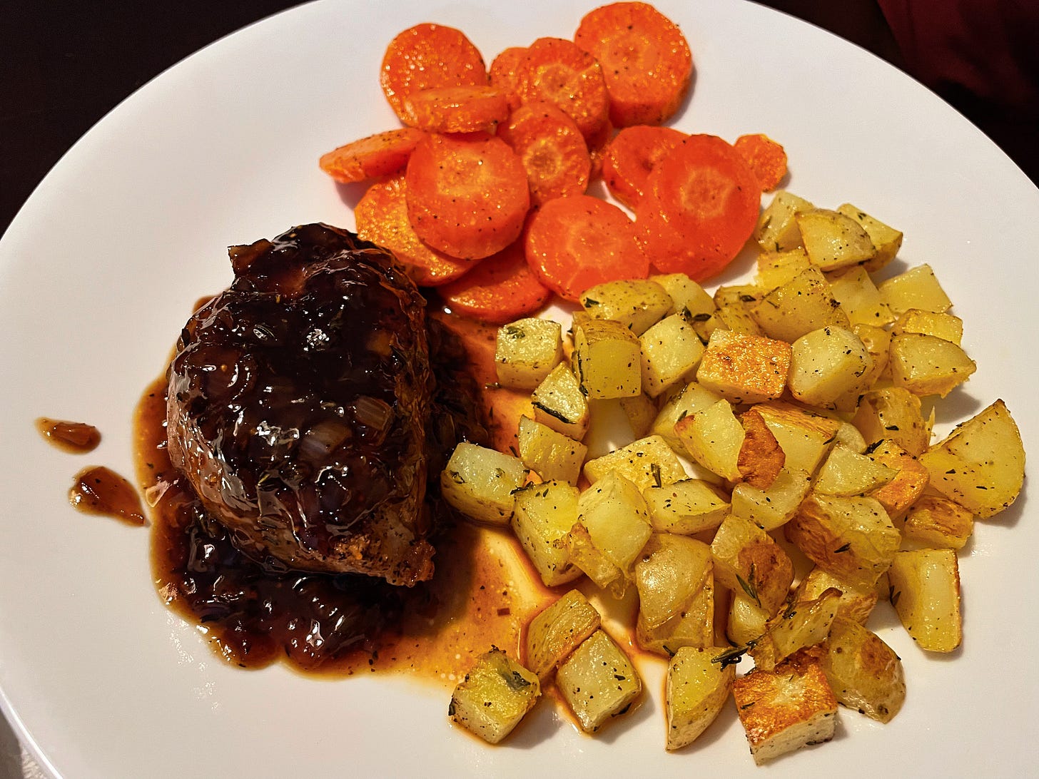 Porkchops with fig adn balsamic sauce with roasted potatoes and carrots.