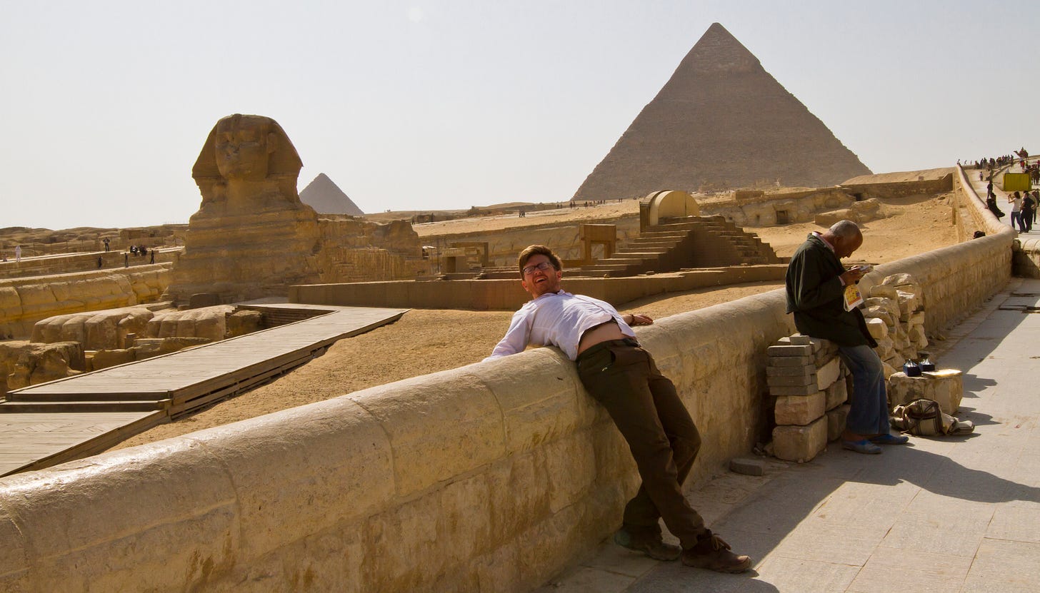 Garrett leaning back and making a dumb face in front of the Sphinx