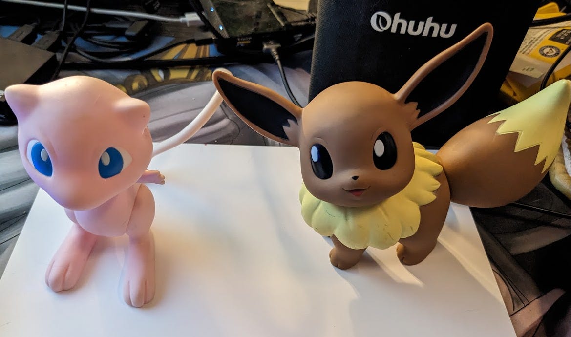 Faeore's Mew and Eevee figures that were gifted to her by her mum