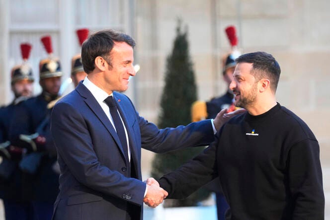 French President Emmanuel Macron, right, welcomes Ukrainian President Volodymyr Zelenskyy at the Elysée Palace in Paris, on Sunday, May 14, 2023.