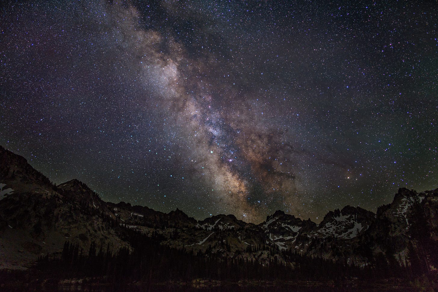 Milky Way, stars, and the Sawtooth Mountains.