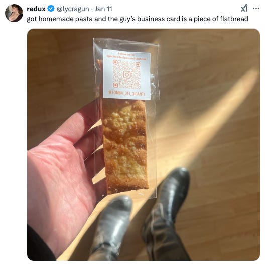 Tweet from @lycragun that says got homeade pasta and the guy's business card is piece of a flatbread