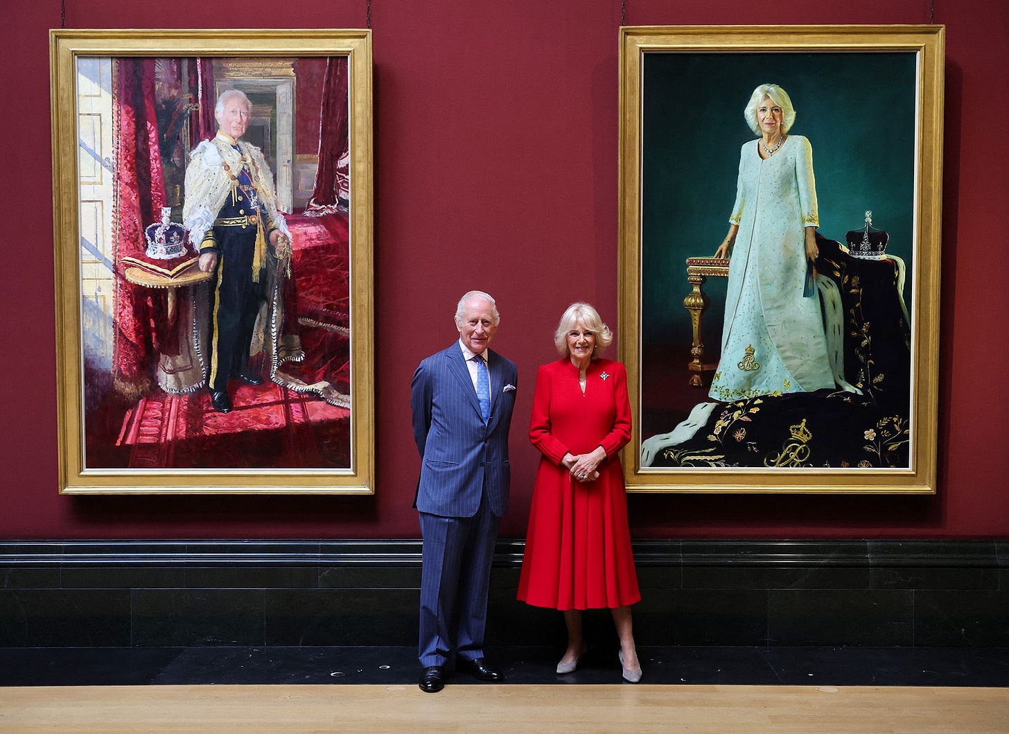 King Charles III and Queen Camilla pose with their official Coronation State Portraits at The National Gallery in London.