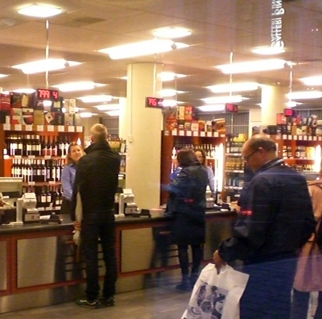 Wine shoppers standing at counter