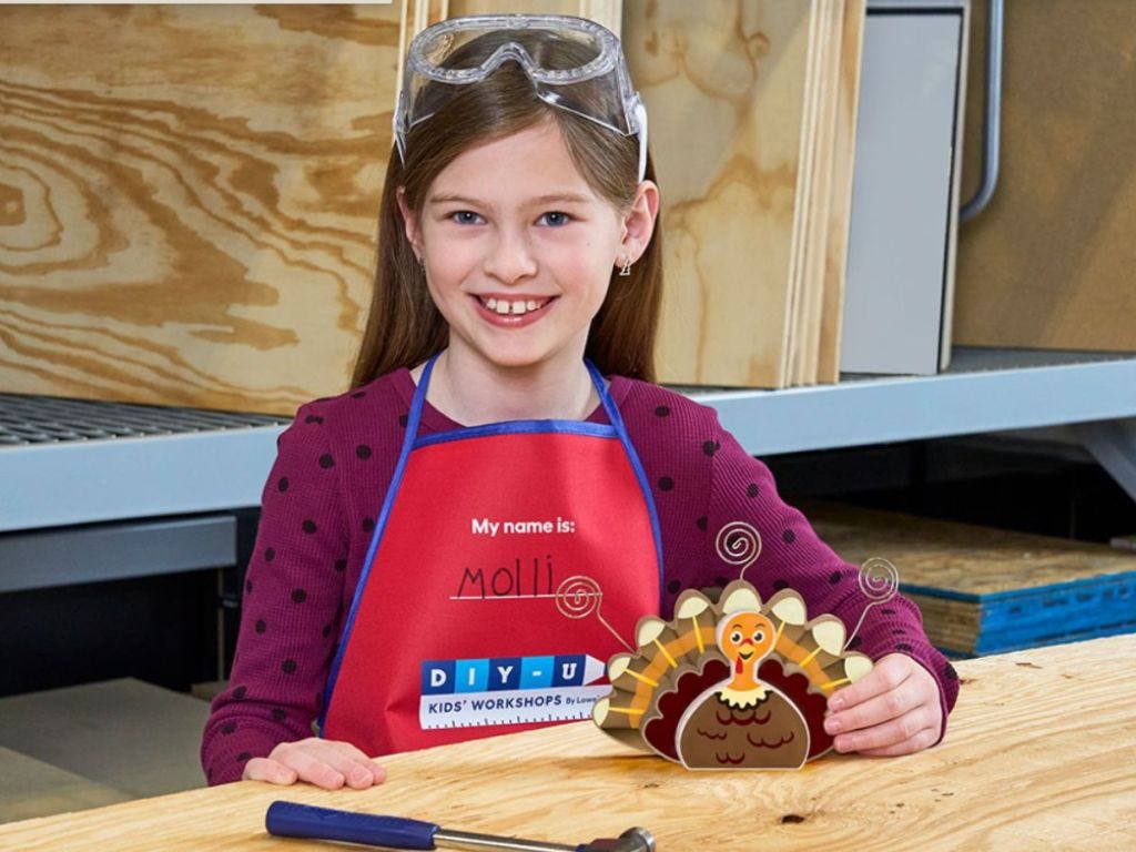 girl in Lowe's vest with Turkey photo holder
