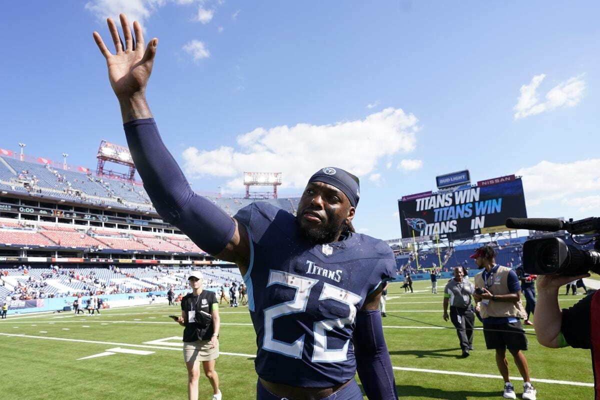 Tennessee Titans running back Derrick Henry (22) waves an NFL football game between the Tennessee Titans and the Cincinnati Bengals, Sunday, Oct. 1, 2023, in Nashville, Tenn. (AP Photo/George Walker IV)