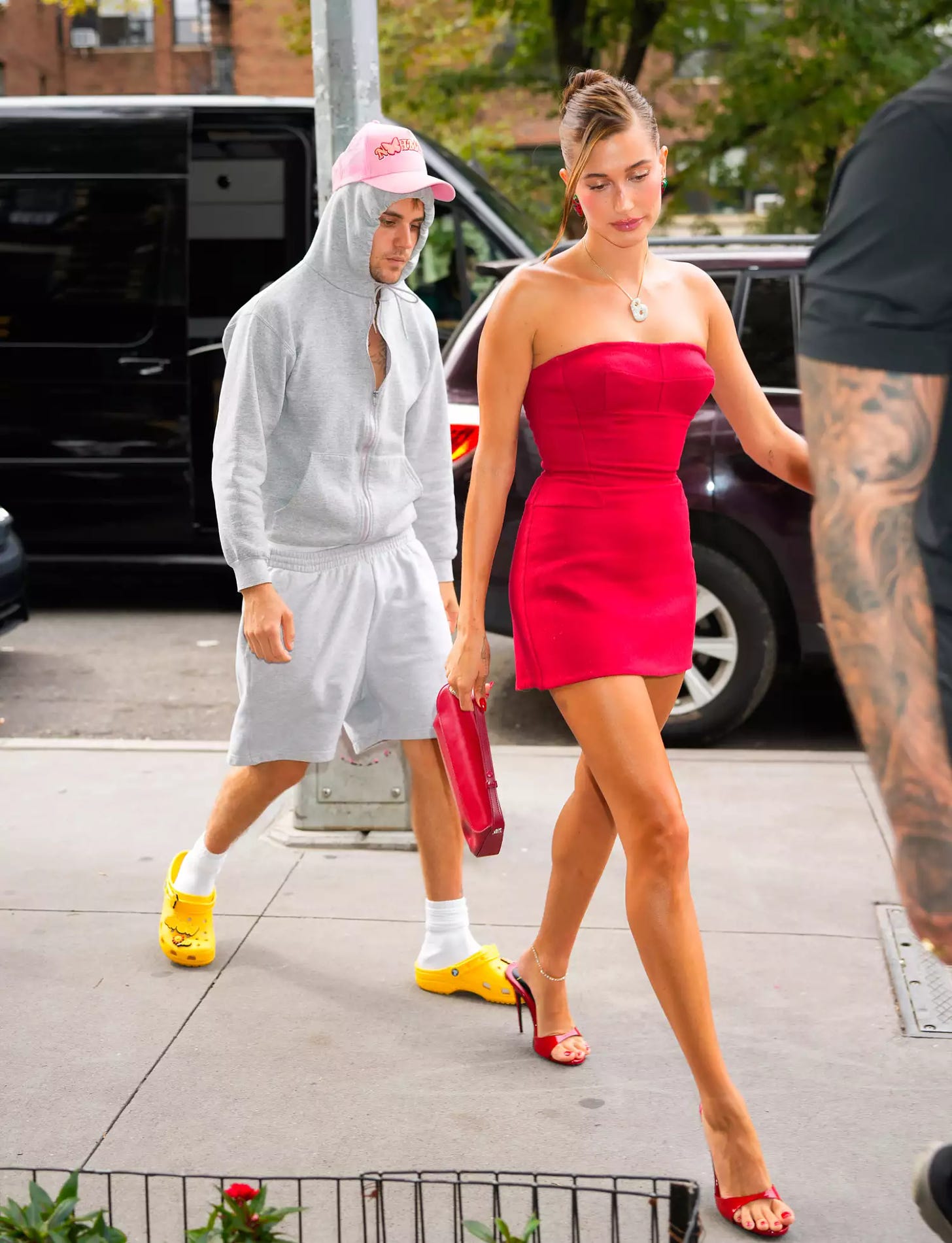Justin Bieber in Sweats and Hailey Bieber in Red Minidress Rhode Strawberry Promotion New York August 2023