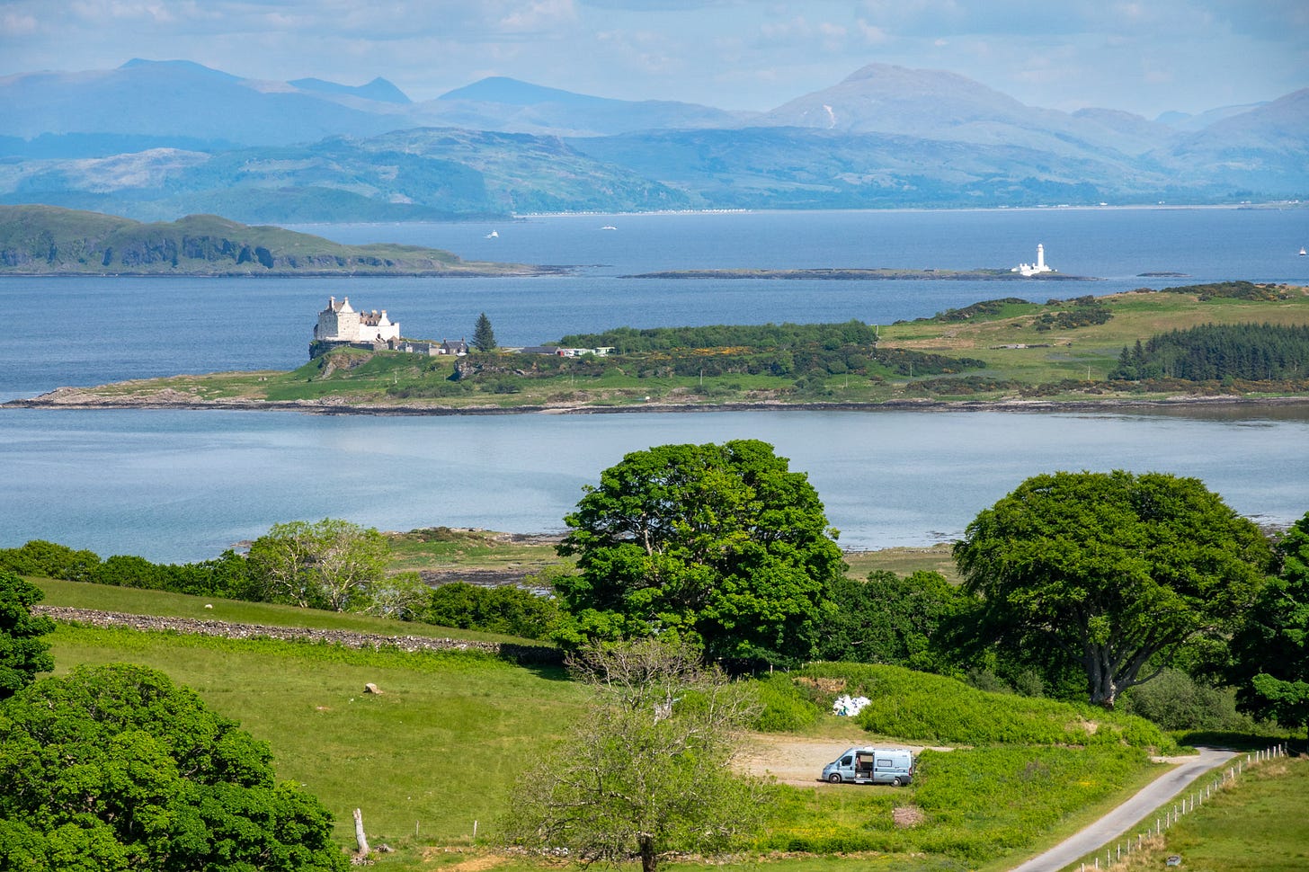 The Dun da Ghaoithe climb starts from a small car park above Torosay Castle, soon gaining a view to Duart Castle (a prominent landmark seen from the ferry) and the lighthouse on a skerry at the west tip of the Isle of Lismore © Felicity Martin
