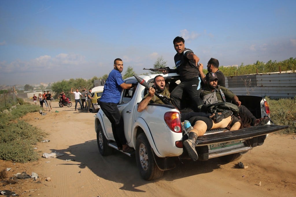 The body of Shani Louk is later seen in the back of a Hamas terrorists' pickup truck after the festival.