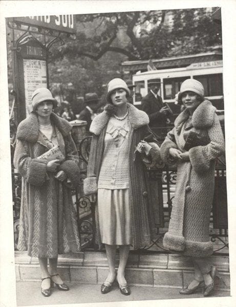 an old photo of three women standing together