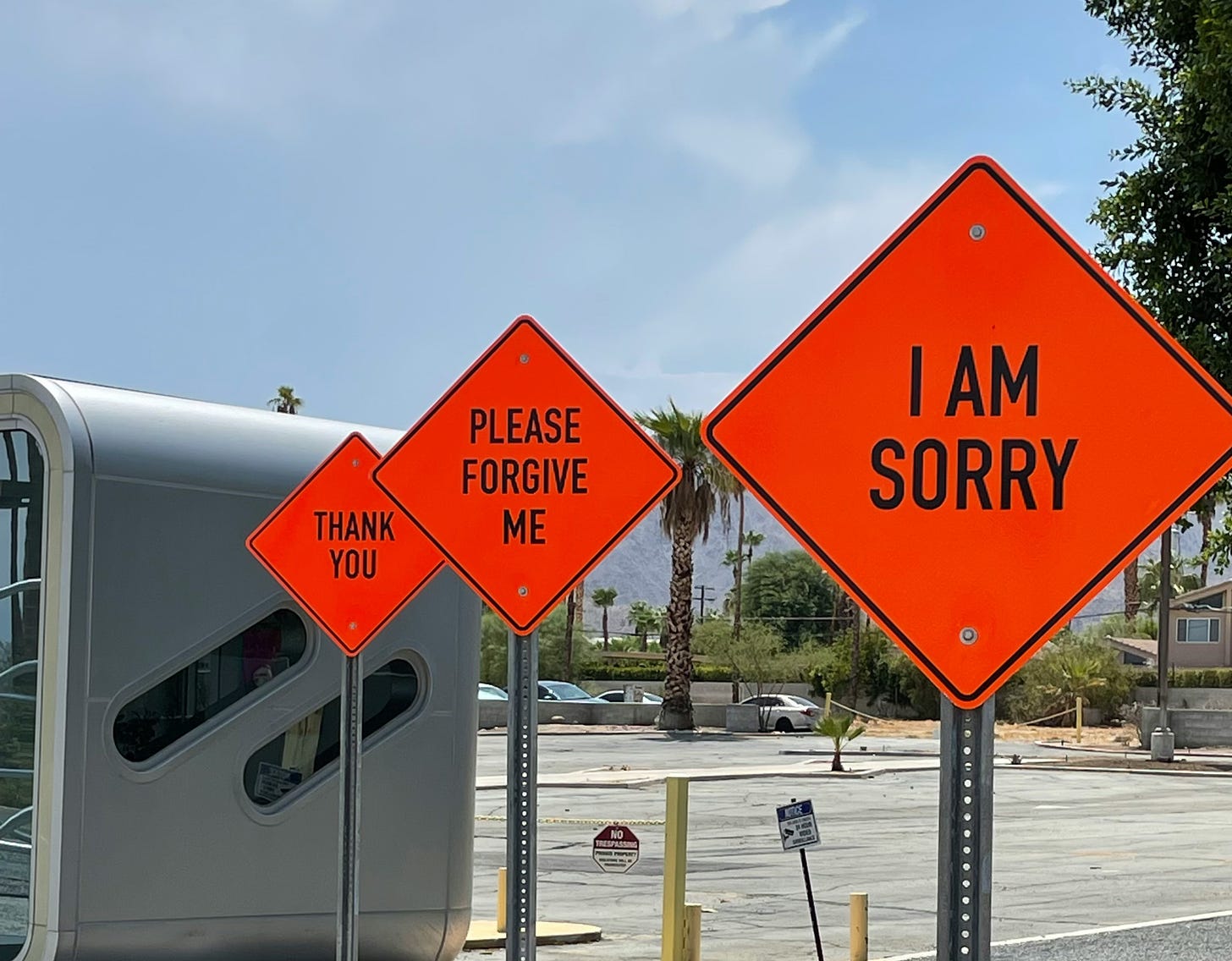 Three American road signs which spell out ‘I’m sorry, please forgive me, thank you’