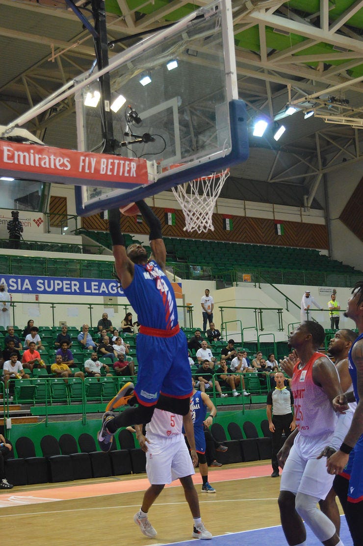 Jeremy Evans dunking for Manama Club 