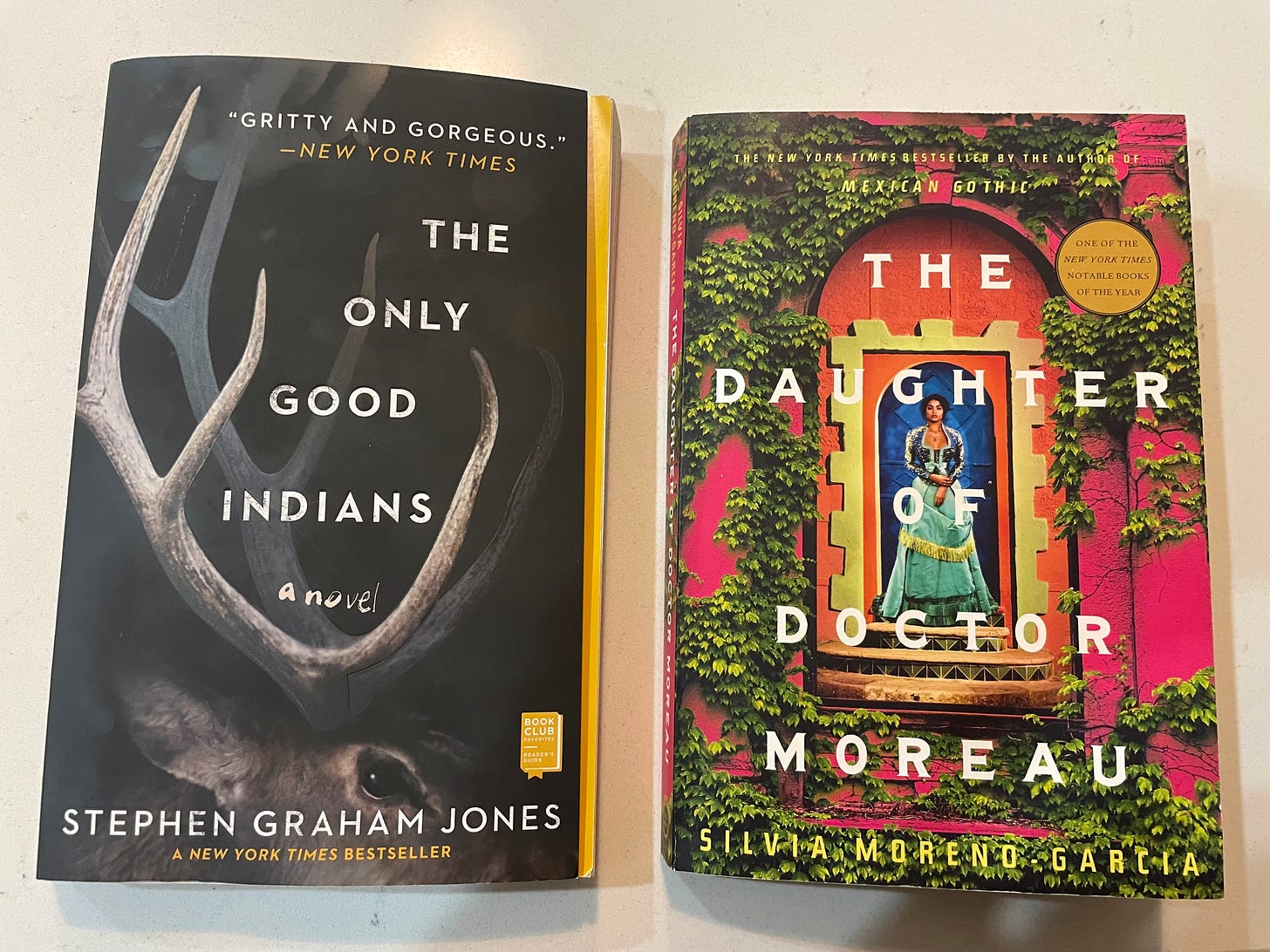 two books: 'The Only Good Indians' by Stephen Graham Jones and 'The Daughter of Doctor Moreau' by Silvia Moreno-Garcia