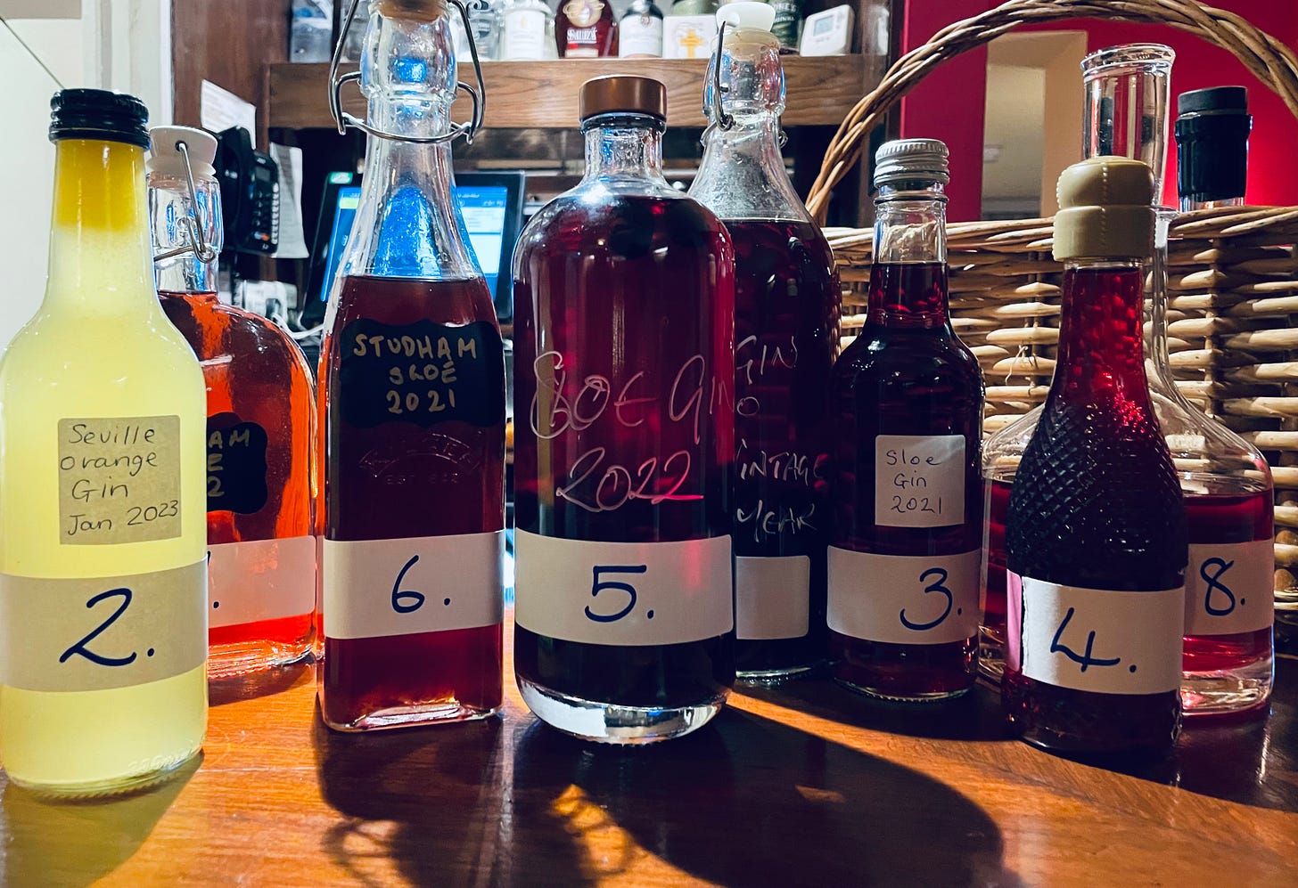 A line up of home brewed sloe gin