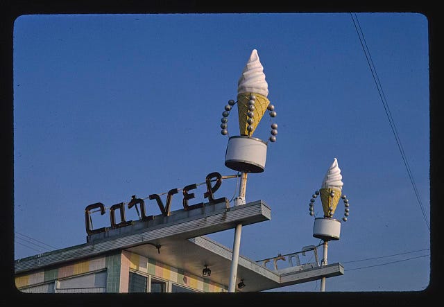 Carvel sign with giant ice cream cones.