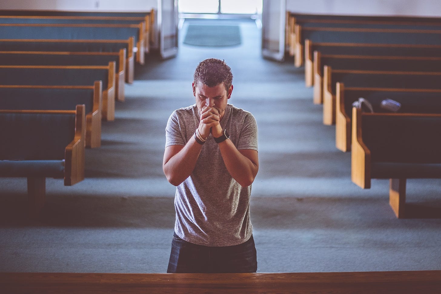 Man praying in church