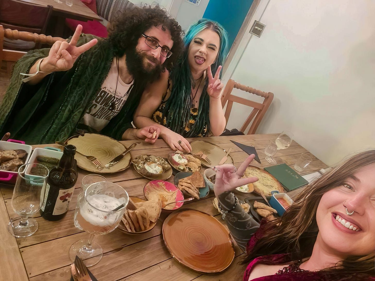 Georgie, Mimi and Ghandi take a selfie while celebrating at a Greek Restaurant in Ellesmere, Shropshire, England, United Kingdom.