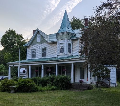 two story house with turret