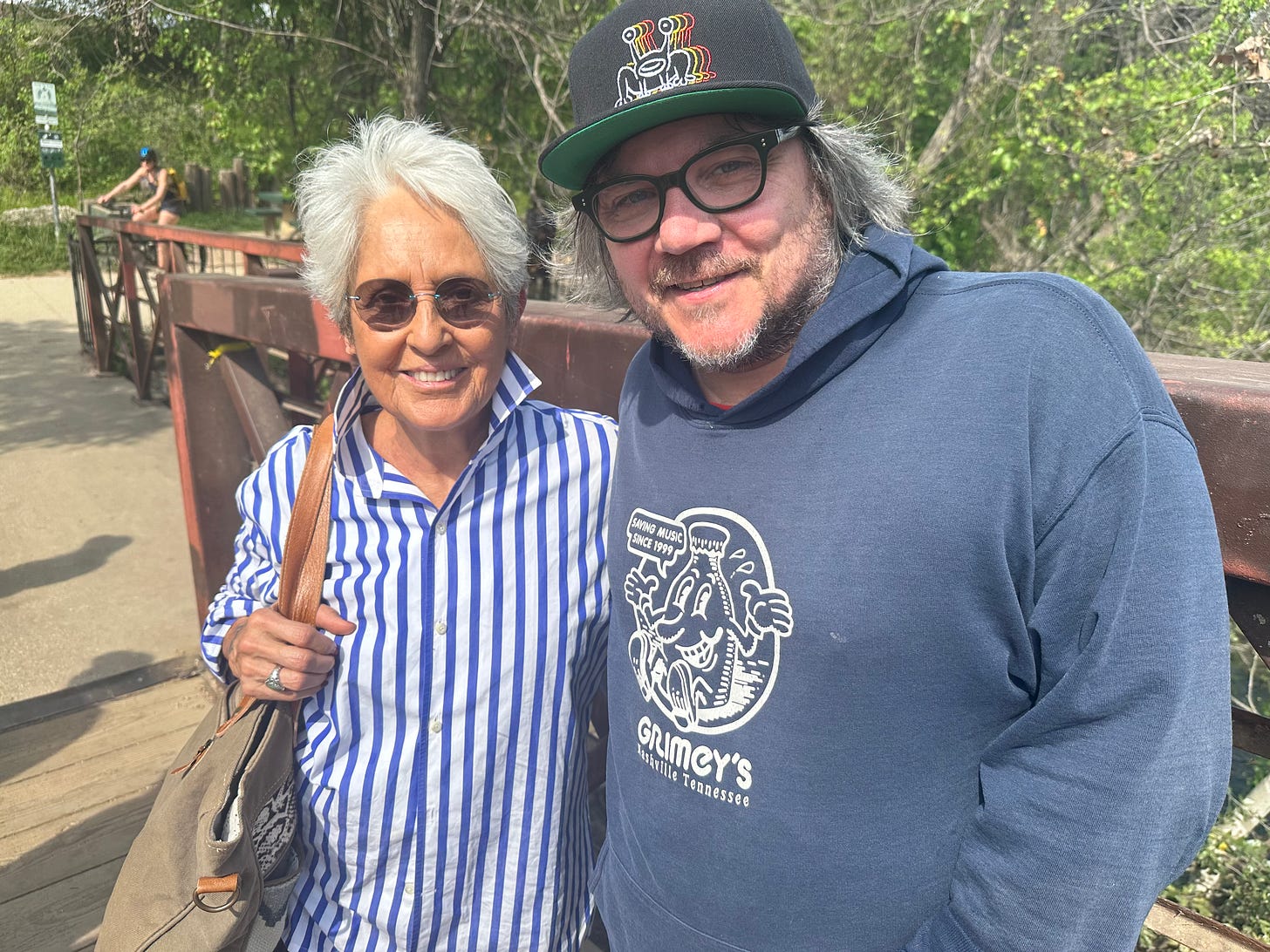 Joan Baez and Jeff Tweedy pose in a park in Austin, Texas.