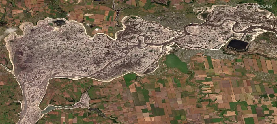 Satellite imagery from last June shows depleted water levels of the Dnieper River by the Zaporizhzhia nuclear power plant, following the destruction of the Khakovka dam.  (Maxar)