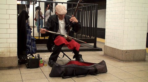 Chinese man street performer playing Erh... | Stock Video | Pond5
