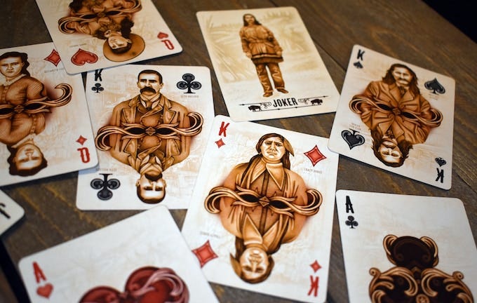 Several Old West-inspired playing card designs.