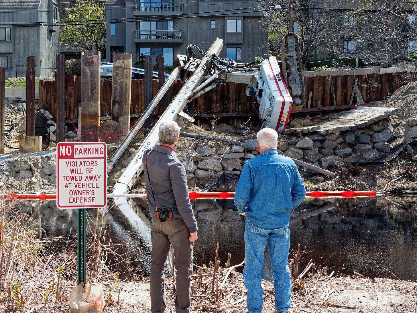 Two men observing accident