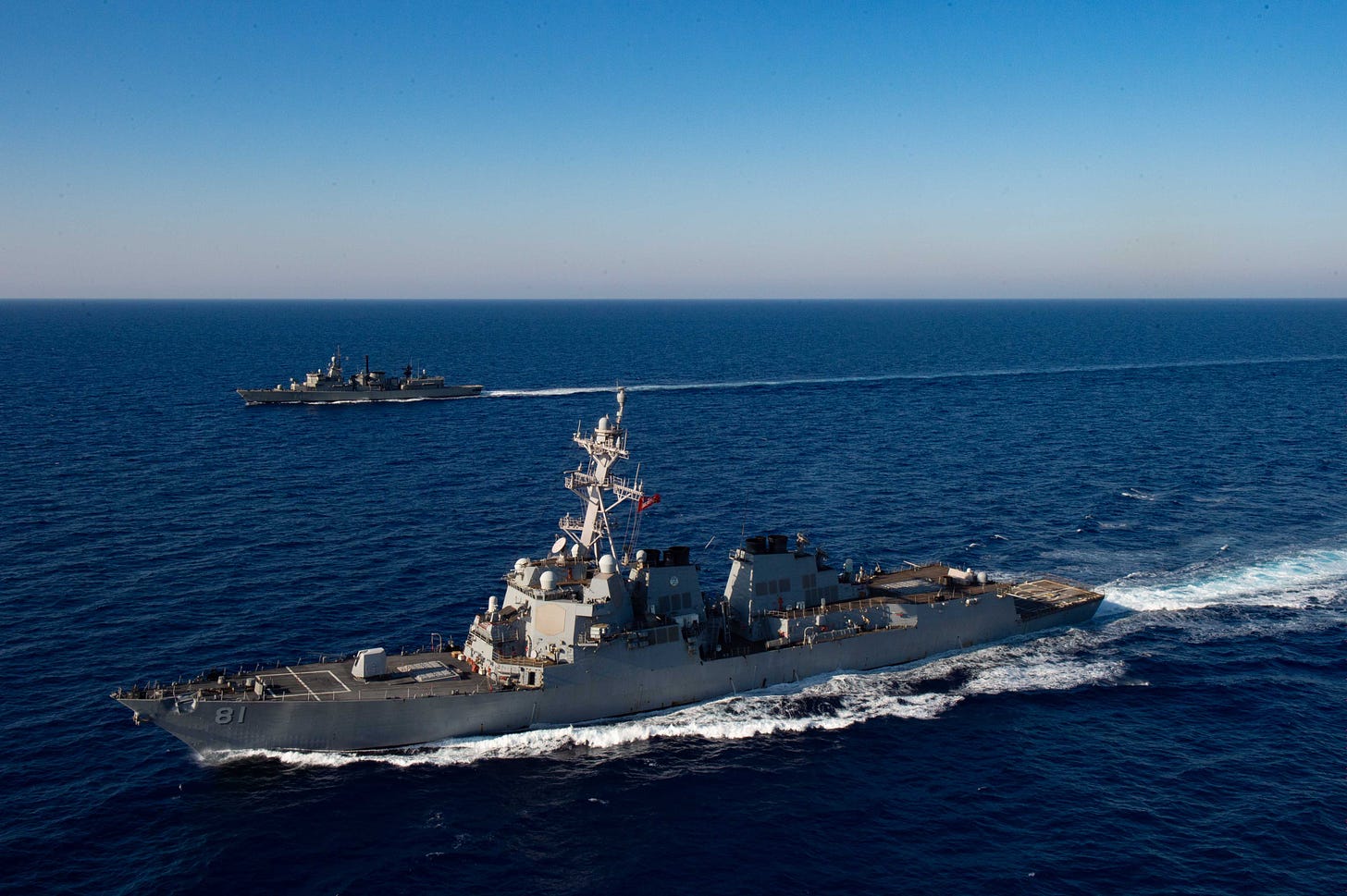 The Arleigh Burke-class guided-missile destroyer USS Winston S. Churchill (DDG 81) executes maneuvering drills with Hellenic Navy frigate Aegean (F 460) in the Mediterranean Sea.