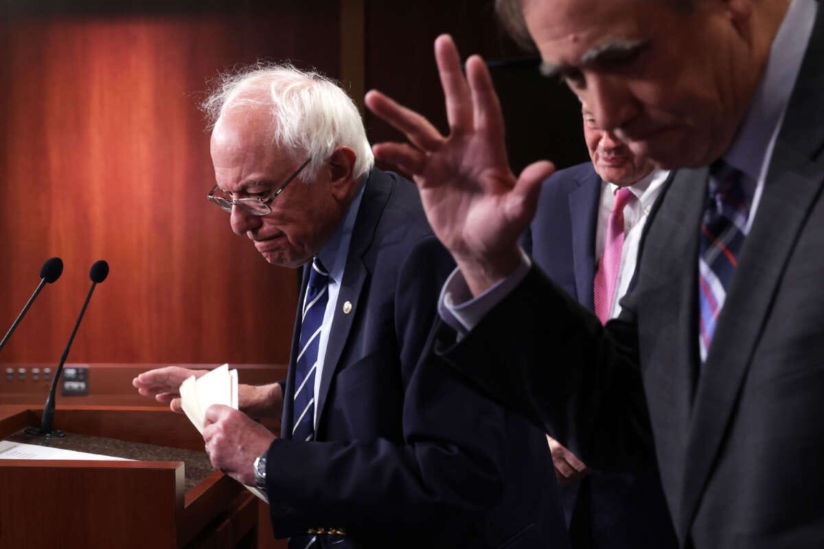 Sen. Bernie Sanders (left) and Sen. Jeff Merkley leave after a news conference on debt limit at the U.S. Capitol on May 18, 2023, in Washington, D.C.