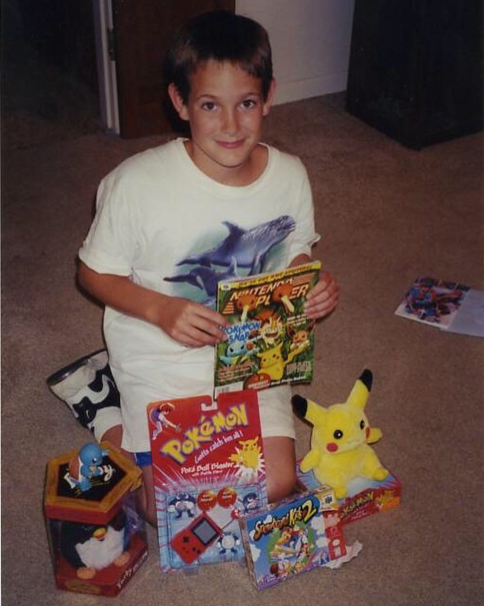 Scott's love of Pokémon dates back to 1999 when he was a kid. Here he is with his Pikachu plush, a Poké Ball Blaster, and a copy of Nintendo Power, advertising Pokémon Snap