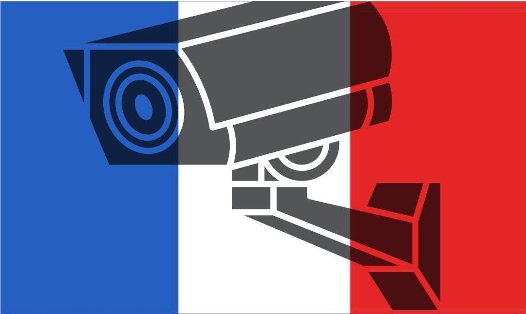 A clip art surveillance camera with the colors of the French flag overlaid on top of it.