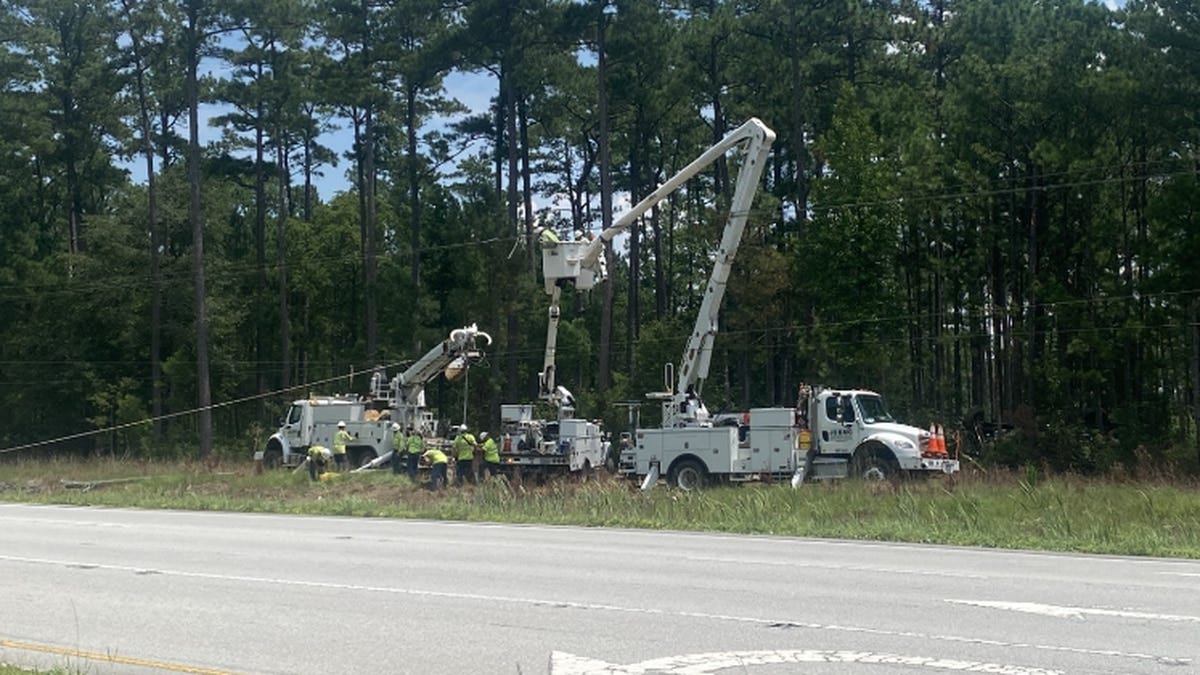 Crews work to restore power after a car struck a power pole in Onslow County.