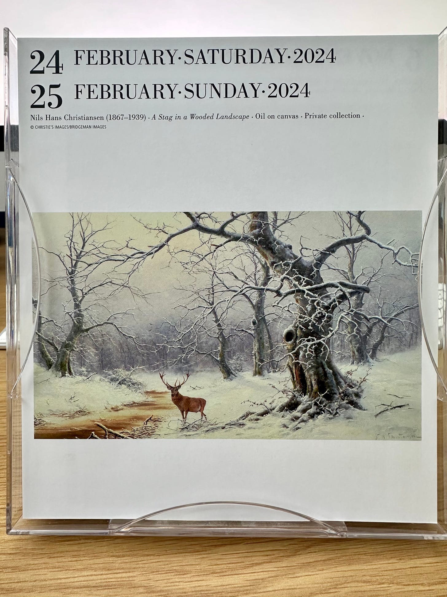 Image shows a painting of a stag in a snowy wood