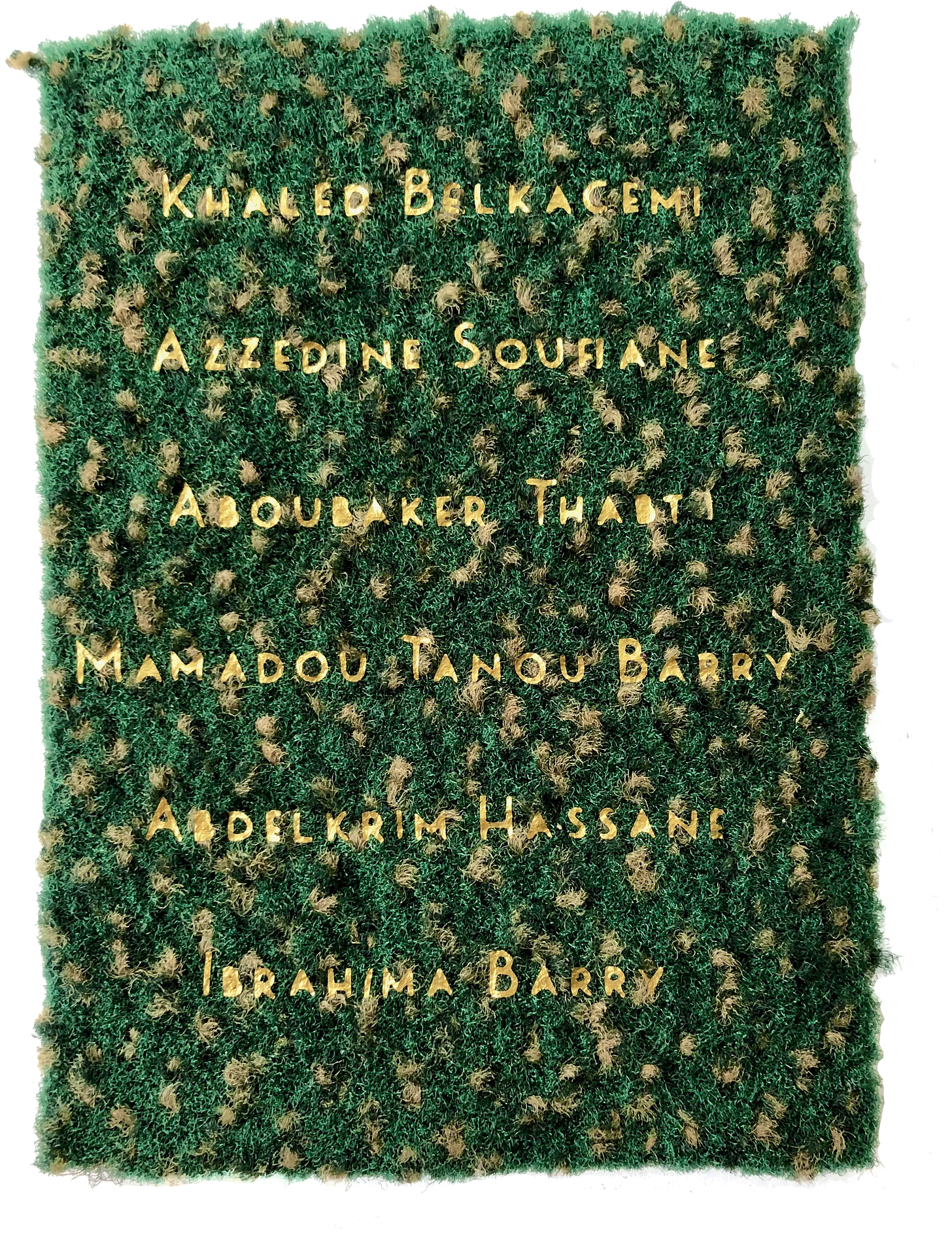 Names of Khaled Belkacemi, Azzedine Soufiane, Aboubakar Thabti, Mamadou Tanou Barry, Abdelkrim Hassane and Ibrahima Barry rendered in gold on a patch of carpet from the CCIQ Mosque in Quebec City