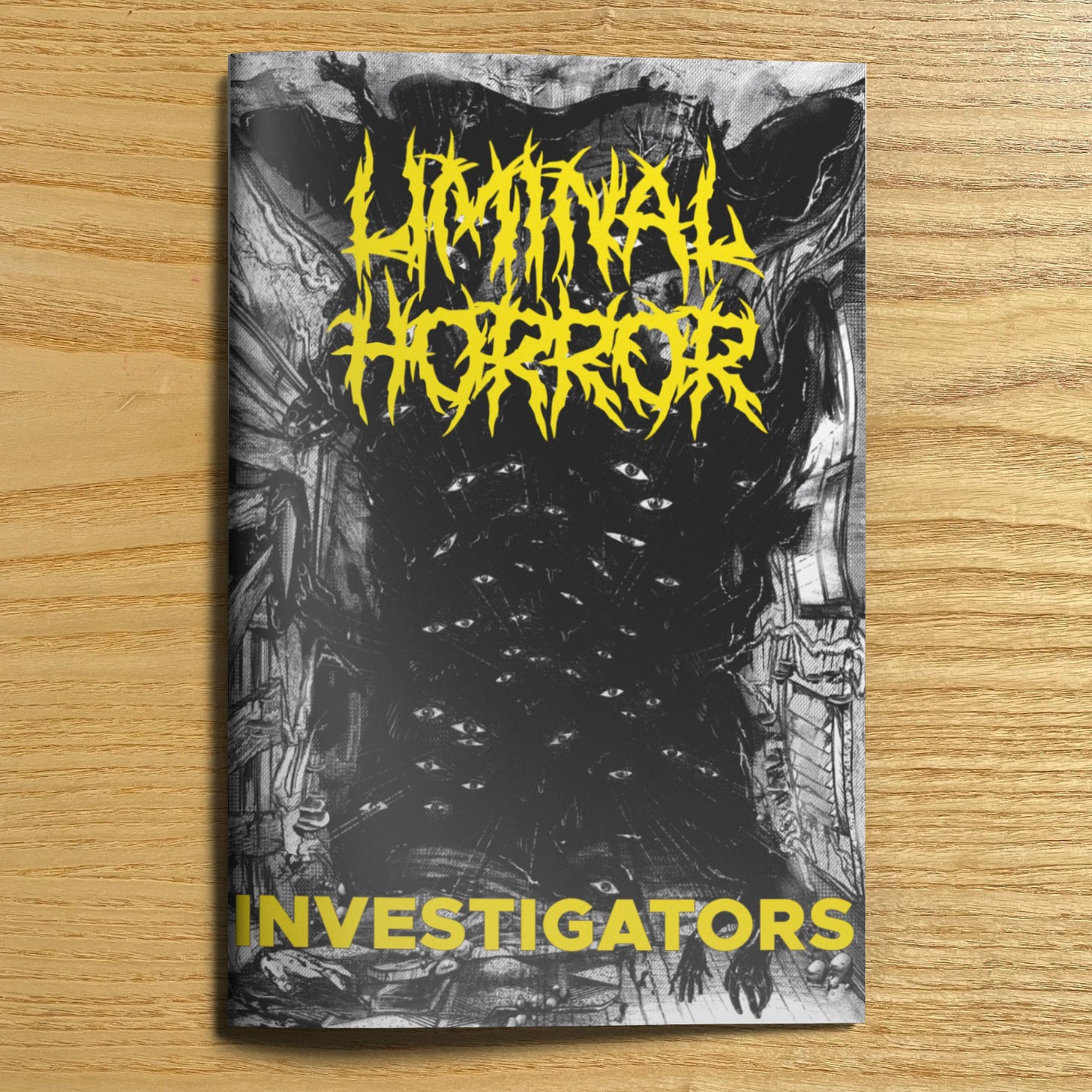 A physical copy of Liminal Horror Investigators by Goblin Archives. The cover is a black and white illustration of a void with peering eyes and grasping hands.