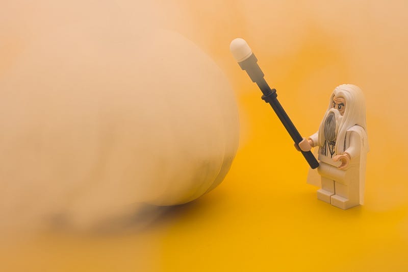 A lego wizard with a staff and a cloud of smoke A lego wizard with a staff and a cloud of smoke