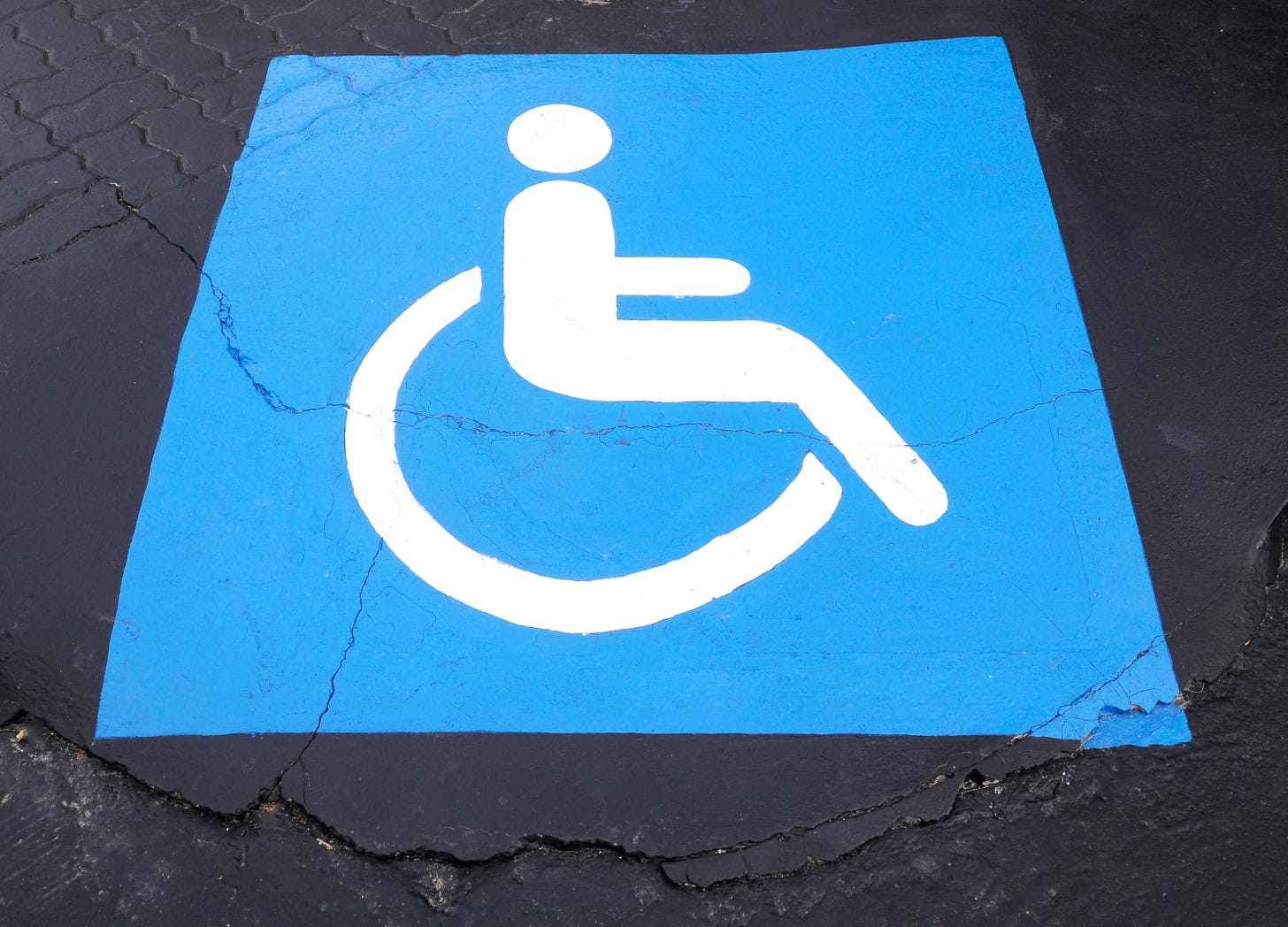 Wheelchair symbol painted onto pavement