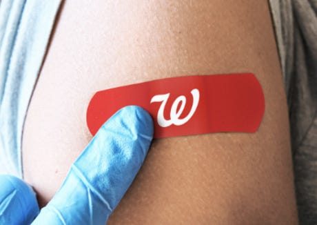 Red bandaid on arm with Walgreen's "W"