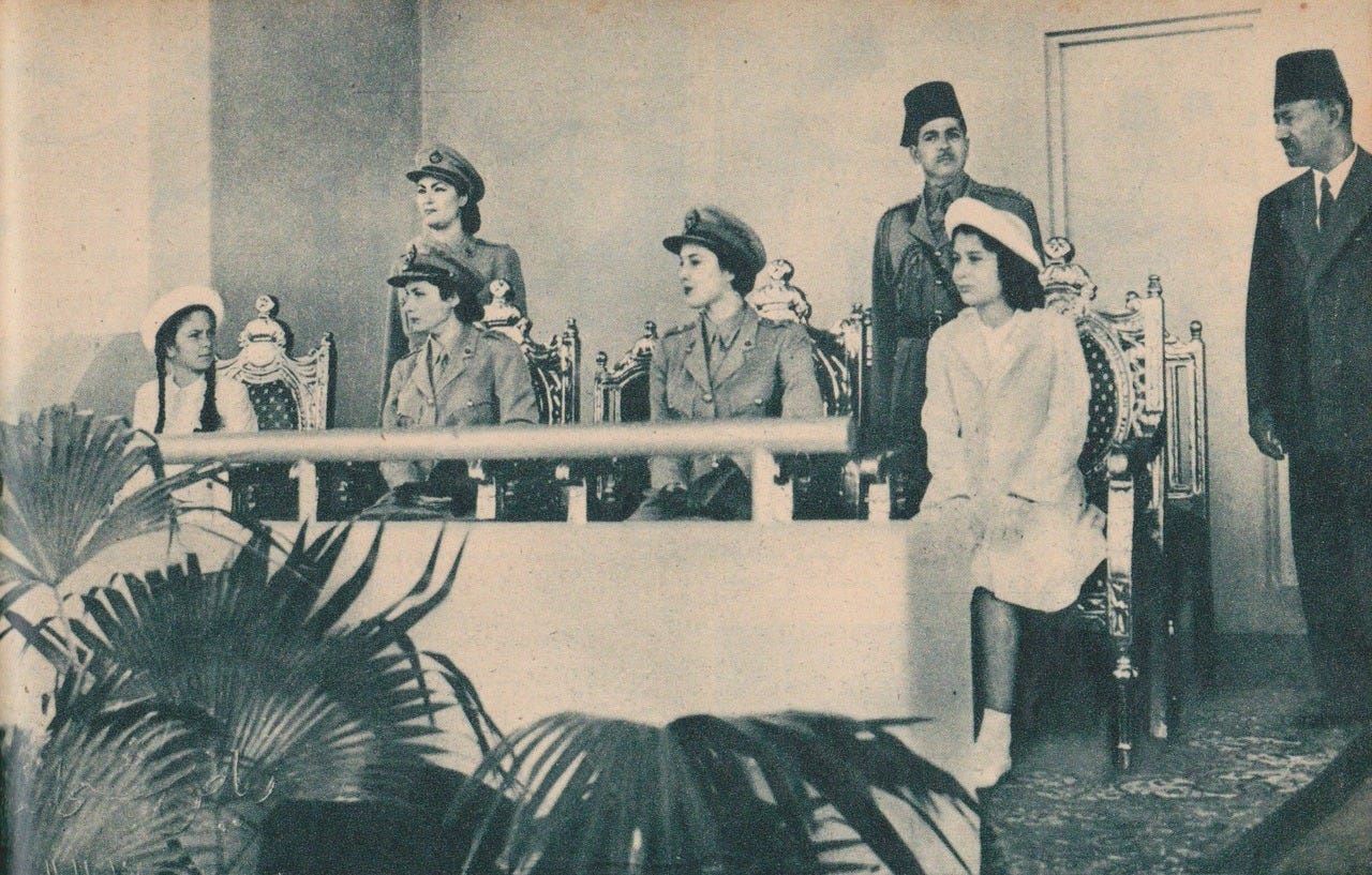 Princesses Fawzia and Fayza in military gear observing military exercises during the Egyptian-Israeli war of 1948