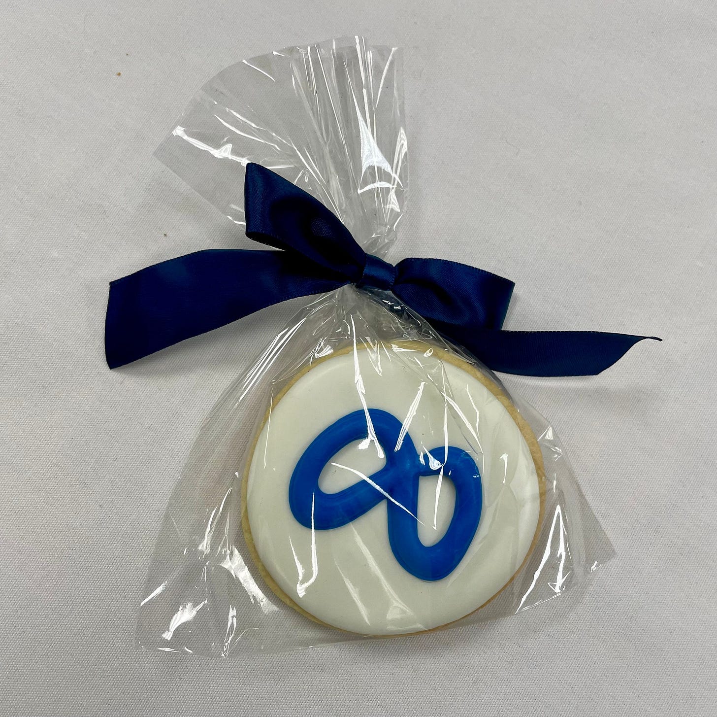 Sugar cookie with the Meta logo on it