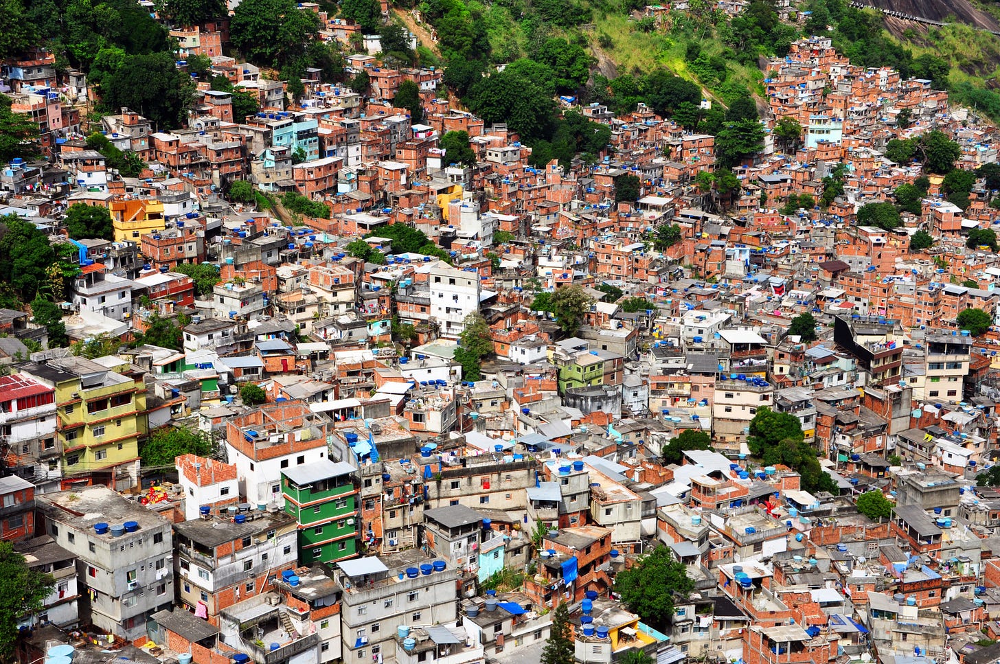 Hundreds of homes on a Rio de Janeiro hillside jammed together, slums of the working class