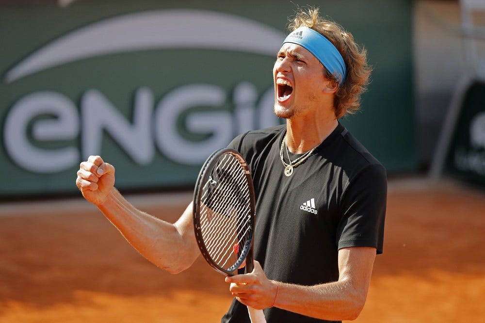 alexander zverev cheers winning against novak djokovic french open