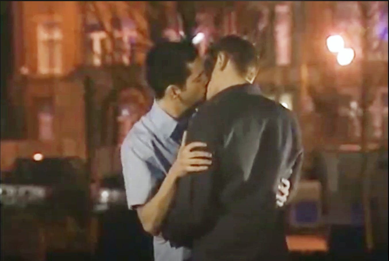 A scene from Coronation Street, Todd and Karl have their first kiss on canal street at night time