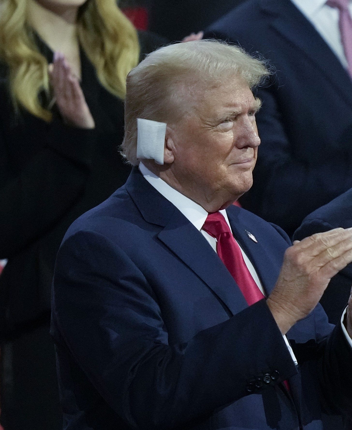 Trump enters Republican convention with a bandage covering his right ear after assassination attempt