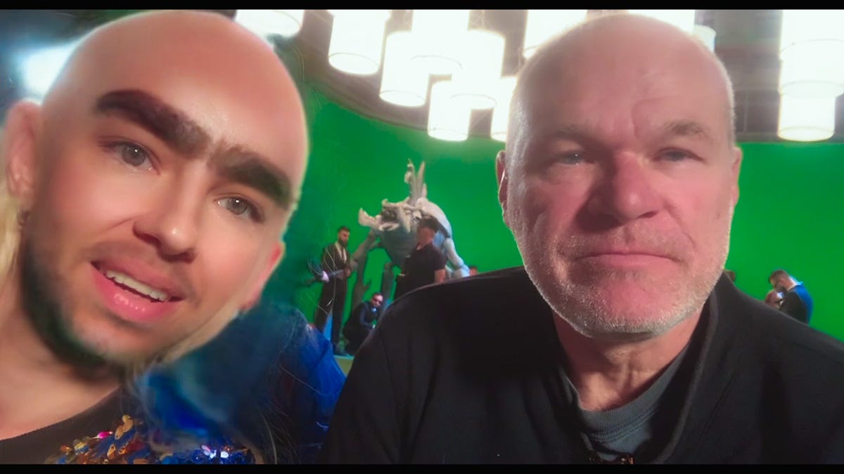 A selfie of Angela (Ilinca Manolache) with an Andrew Tate face filter and director Uwe Boll